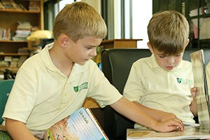 Boys reading in the Monsignor Slade library.